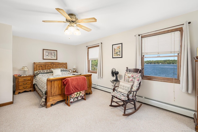 138 S Shore Rd, Killingly, CT 06241 - carpeted bedroom featuring multiple windows, baseboard heating, and ceiling fan