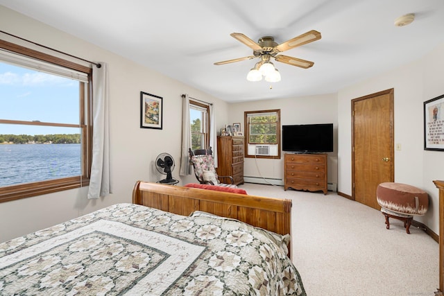 138 S Shore Rd, Killingly, CT 06241 - bedroom featuring a baseboard radiator, light carpet, cooling unit, a ceiling fan, and a water view