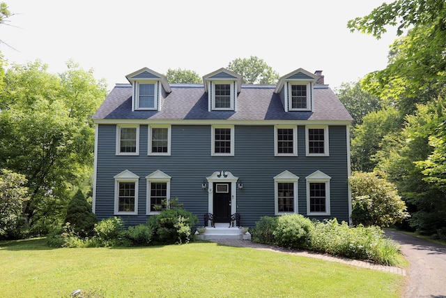 9 River Bend Ln, Windsor, CT 06095 - colonial home featuring a front lawn and a chimney