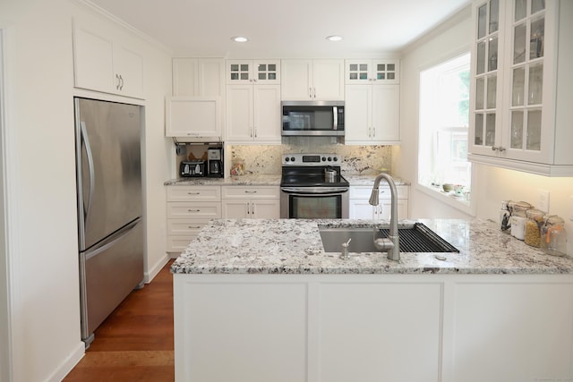 9 River Bend Ln, Windsor, CT 06095 - kitchen featuring appliances with stainless steel finishes, a peninsula, tasteful backsplash, white cabinets, and light stone counters