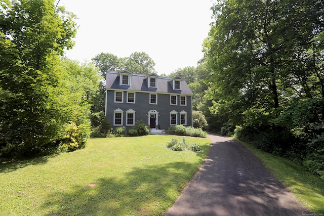 9 River Bend Ln, Windsor, CT 06095 - colonial home with a front yard, driveway, and a chimney