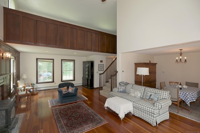 9 River Bend Ln, Windsor, CT 06095 - living room with a chandelier, stairs, a high ceiling, and wood finished floors