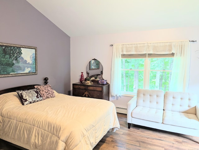 19 Wendell Rd, Ellington, CT 06029 - bedroom featuring vaulted ceiling, a baseboard heating unit, and wood finished floors