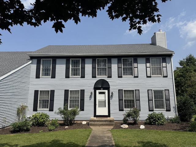 16 Snow Rdg S, Middletown, CT 06457 - colonial inspired home with a chimney, a front yard, and a shingled roof