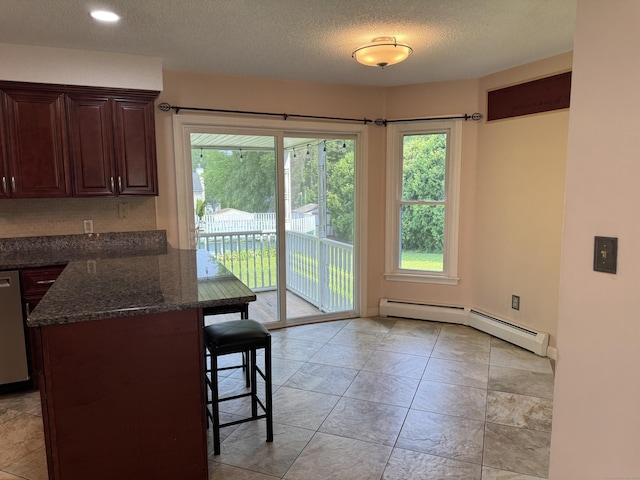 16 Snow Rdg S, Middletown, CT 06457 - dining room featuring a baseboard heating unit, plenty of natural light, and a textured ceiling
