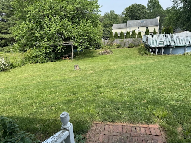 16 Snow Rdg S, Middletown, CT 06457 - view of green lawn featuring a wooden deck and an outdoor pool