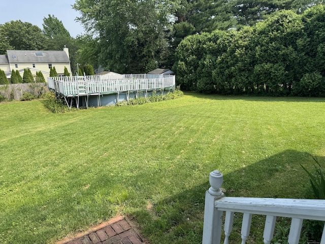 16 Snow Rdg S, Middletown, CT 06457 - view of green lawn with a wooden deck and an outdoor pool
