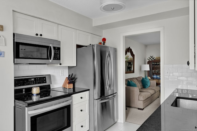 148 Conestoga Way Unit 148, Glastonbury, CT 06033 - kitchen with appliances with stainless steel finishes, white cabinets, and backsplash