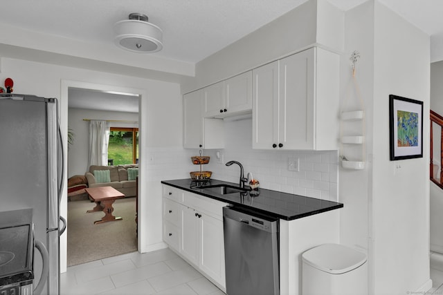 148 Conestoga Way Unit 148, Glastonbury, CT 06033 - kitchen featuring stainless steel appliances, dark countertops, and white cabinetry