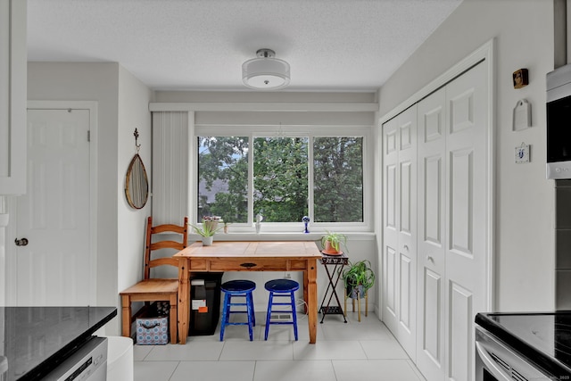 148 Conestoga Way Unit 148, Glastonbury, CT 06033 - dining room with tile patterned flooring and a textured ceiling