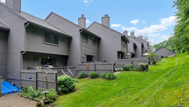 148 Conestoga Way Unit 148, Glastonbury, CT 06033 - rear view of property featuring a chimney and a deck