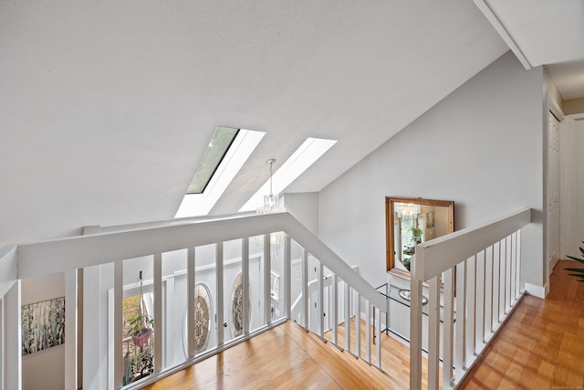 21 Derek Ln, Windsor, CT 06095 - staircase with a skylight, lofted ceiling, and wood finished floors