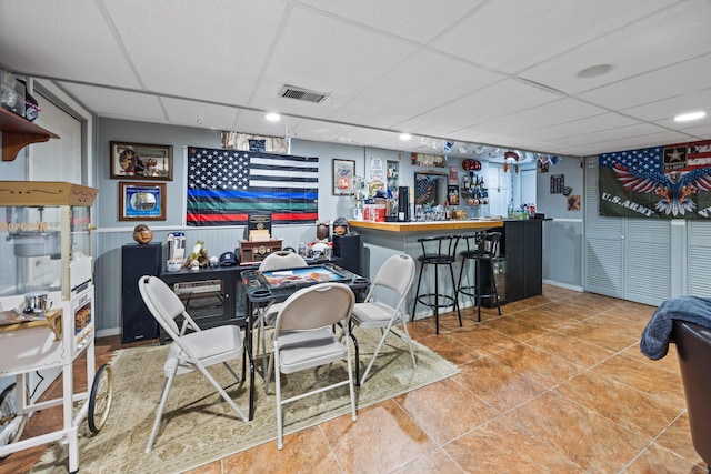 21 Derek Ln, Windsor, CT 06095 - tiled dining space featuring a drop ceiling and a bar