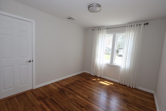 26 Riverdale Rd, Milford, CT 06460 - unfurnished room with dark wood-type flooring and baseboards