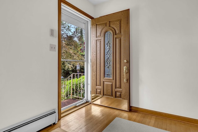 108 Sandelwood Dr, Madison, CT 06443 - entrance foyer featuring baseboard heating and wood-type flooring
