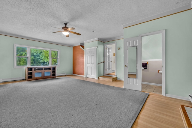 108 Sandelwood Dr, Madison, CT 06443 - unfurnished bedroom with ornamental molding, light wood-type flooring, a textured ceiling, a baseboard heating unit, and a ceiling fan