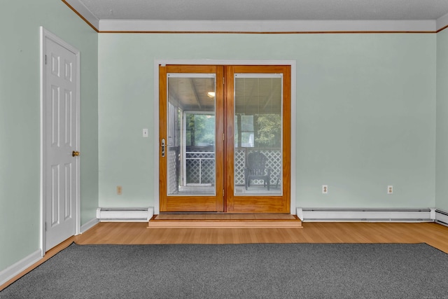 108 Sandelwood Dr, Madison, CT 06443 - empty room with baseboard heating, wood finished floors, and french doors