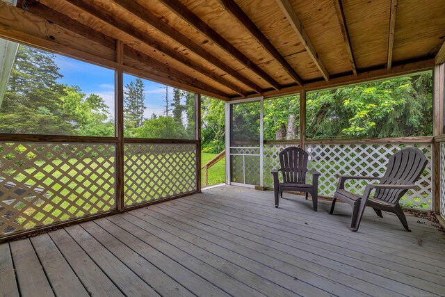 108 Sandelwood Dr, Madison, CT 06443 - deck featuring view of wooded area and a sunroom