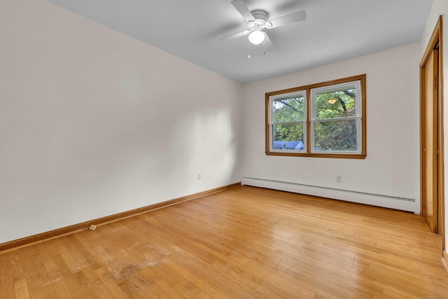 108 Sandelwood Dr, Madison, CT 06443 - unfurnished bedroom with baseboard heating, light wood-type flooring, and ceiling fan