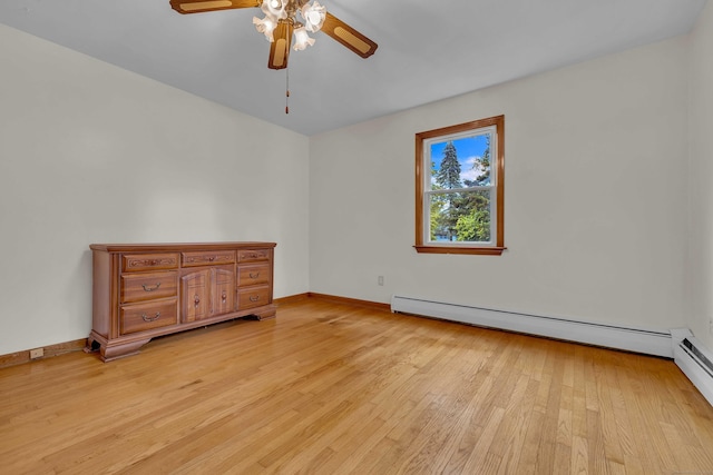 108 Sandelwood Dr, Madison, CT 06443 - spare room with a baseboard radiator, ceiling fan, and light wood-style flooring