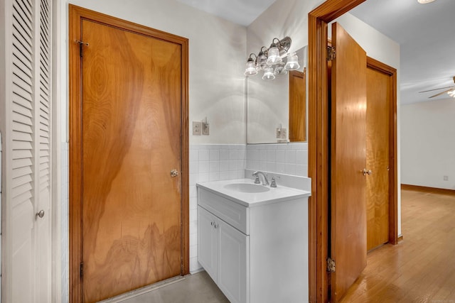 108 Sandelwood Dr, Madison, CT 06443 - bathroom with a closet, vanity, a ceiling fan, and wood finished floors