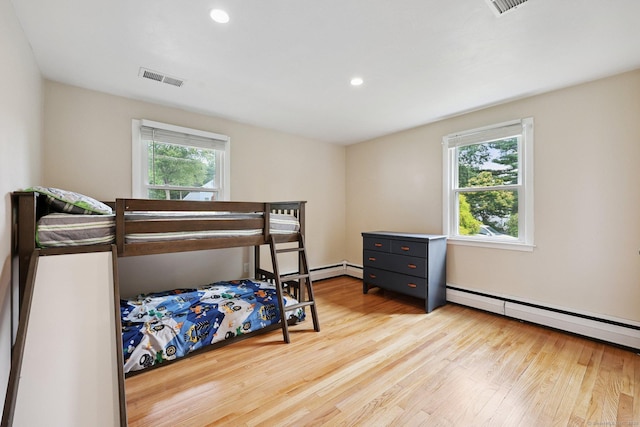 82 Shipman Dr, Glastonbury, CT 06033 - bedroom featuring baseboard heating, light wood-type flooring, and recessed lighting
