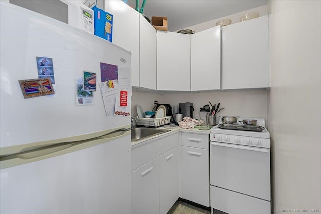 100 York St Unit 10R, New Haven, CT 06511 - kitchen featuring white appliances, light countertops, and white cabinets