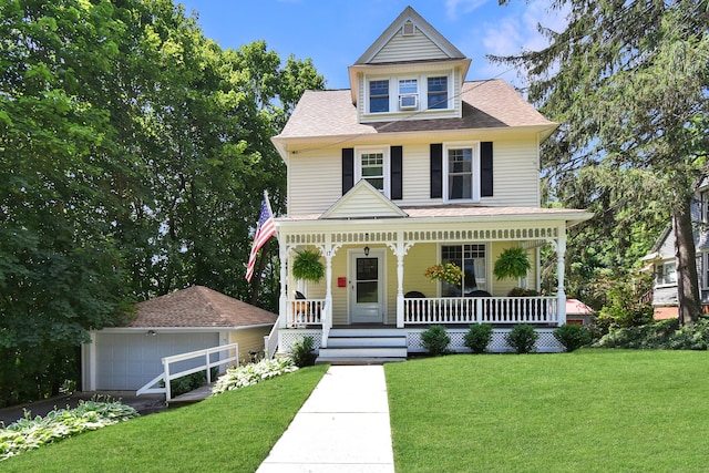 17 Adams St, Winchester, CT 06098 - view of front of home featuring a porch, a garage, a front lawn, and a shingled roof