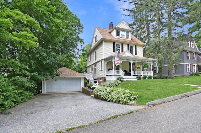 17 Adams St, Winchester, CT 06098 - view of front of property featuring an outbuilding, covered porch, a garage, a chimney, and a front lawn