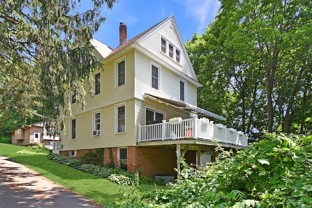 17 Adams St, Winchester, CT 06098 - view of side of property featuring a chimney and a deck