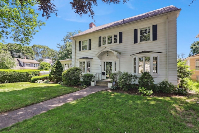 110 Westwood Rd, New Haven, CT 06515 - colonial house featuring a front yard and a chimney