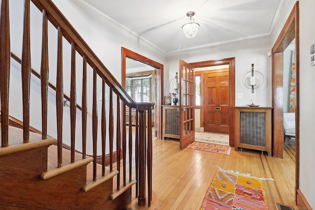 110 Westwood Rd, New Haven, CT 06515 - foyer entrance featuring wood-type flooring, ornamental molding, stairway, and a chandelier