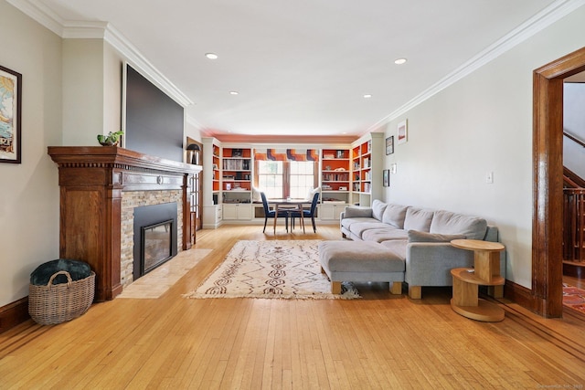 110 Westwood Rd, New Haven, CT 06515 - living room featuring hardwood / wood-style floors, a stone fireplace, ornamental molding, stairway, and recessed lighting
