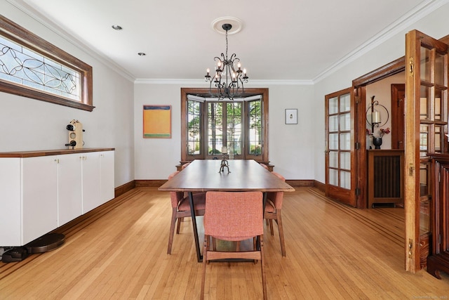 110 Westwood Rd, New Haven, CT 06515 - dining room featuring light wood-type flooring, a chandelier, and ornamental molding