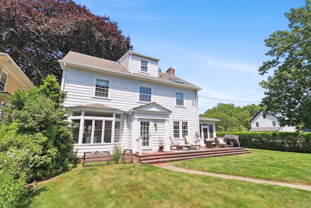 110 Westwood Rd, New Haven, CT 06515 - rear view of house featuring a yard, a chimney, a deck, and a sunroom
