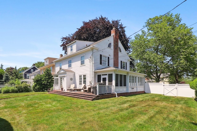 110 Westwood Rd, New Haven, CT 06515 - back of house featuring a chimney, a sunroom, a wooden deck, and a gate
