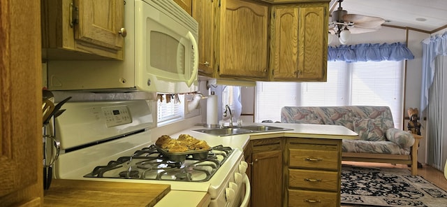 306 Old Colchester Rd Unit 197, Salem, CT 06420 - kitchen with white appliances, brown cabinetry, light countertops, and a peninsula
