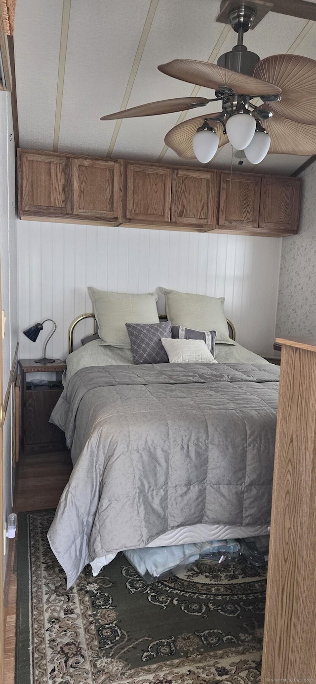 306 Old Colchester Rd Unit 197, Salem, CT 06420 - bedroom featuring wooden walls, a ceiling fan, and wood finished floors