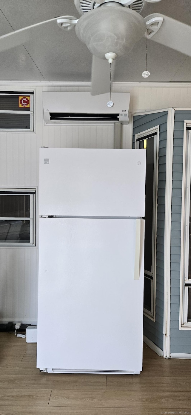 306 Old Colchester Rd Unit 197, Salem, CT 06420 - detailed view of freestanding refrigerator and wood walls