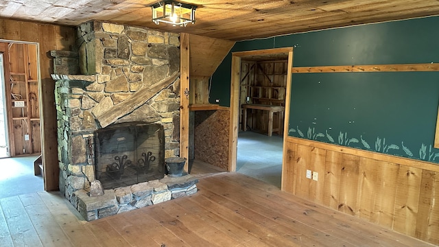 6 Rocky Cove Ln, Cornwall, CT 06796 - unfurnished living room with wooden ceiling, hardwood / wood-style floors, a stone fireplace, and lofted ceiling
