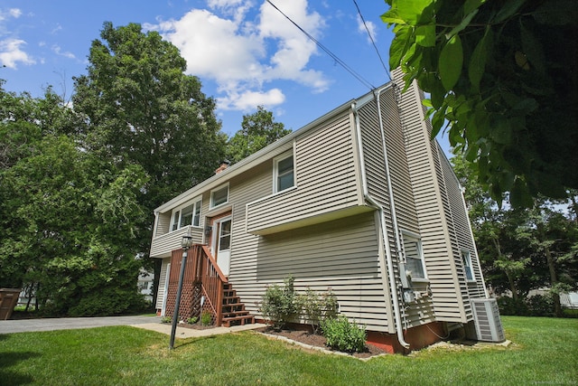 39 Wells Ave, Shelton, CT 06484 - view of front of home with a front lawn and a chimney