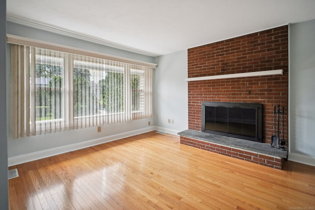 39 Wells Ave, Shelton, CT 06484 - unfurnished living room featuring hardwood / wood-style flooring and a fireplace