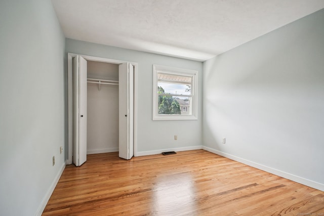 39 Wells Ave, Shelton, CT 06484 - unfurnished bedroom with light wood finished floors and a closet