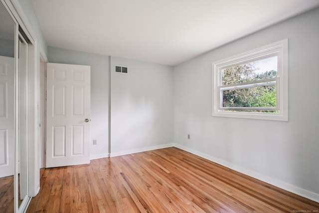 39 Wells Ave, Shelton, CT 06484 - unfurnished bedroom with light wood finished floors and a closet