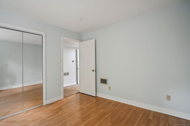 39 Wells Ave, Shelton, CT 06484 - unfurnished bedroom featuring light wood-style flooring and a closet