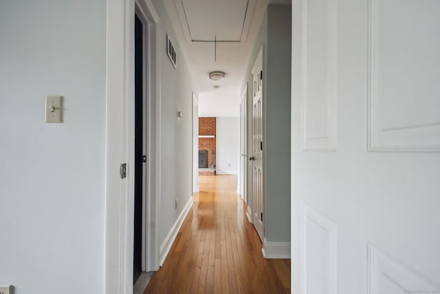 39 Wells Ave, Shelton, CT 06484 - hallway featuring attic access and hardwood / wood-style floors
