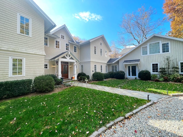 192 Catalpa Rd, Wilton, CT 06897 - view of front of house with a front lawn and board and batten siding