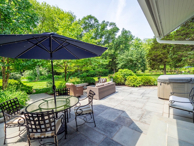 192 Catalpa Rd, Wilton, CT 06897 - view of patio / terrace featuring a hot tub, outdoor dining space, an outdoor living space, and view of wooded area