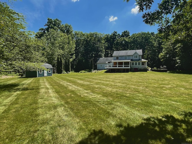 8 Brendans Way, Granby, CT 06035 - view of green lawn with an outbuilding and a wooded view
