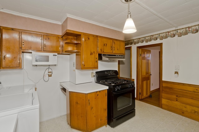 282 Halladay Dr, Suffield, CT 06093 - kitchen featuring gas stove, white microwave, under cabinet range hood, separate washer and dryer, and brown cabinets